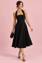 Black midi dress with a flared skirt and square neckline