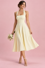 Light yellow midi dress with a flared skirt and square neckline